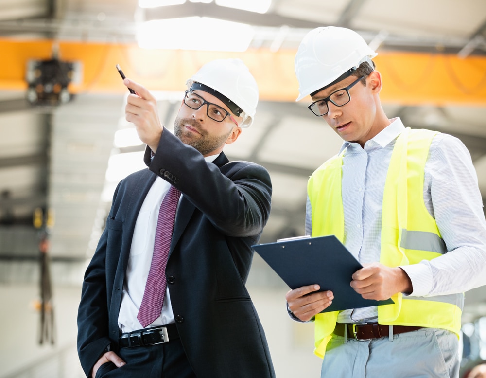 Image of two people in a factory