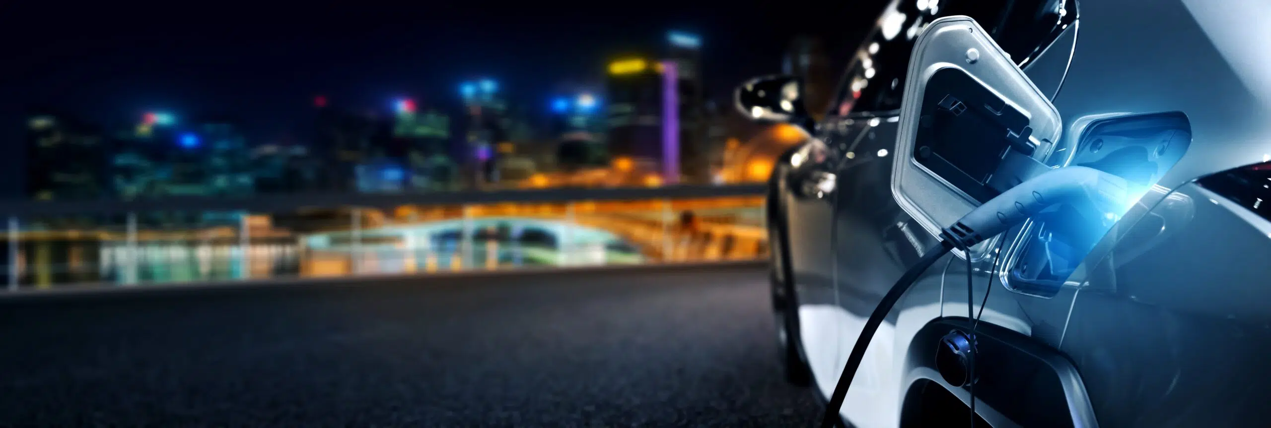 Ev,Charging,Station,For,Electric,Car,In,Concept,Of,Green electric vehicle CV in front of city scape