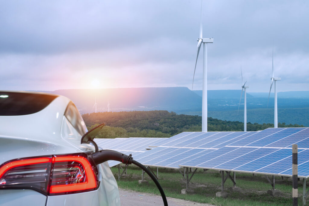 Energy - EV car with wind turbines and solar panels for subscription to newsletter