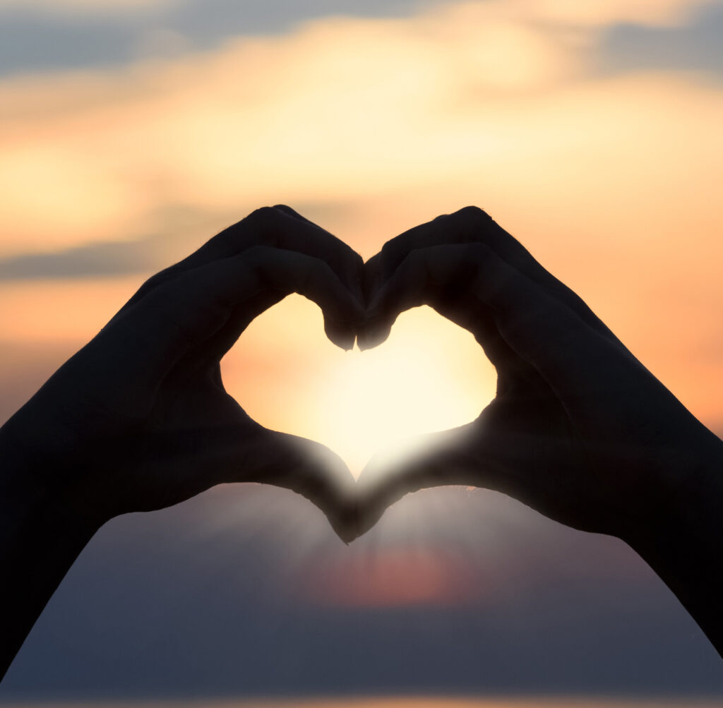 Image of two hands in shape of a heart