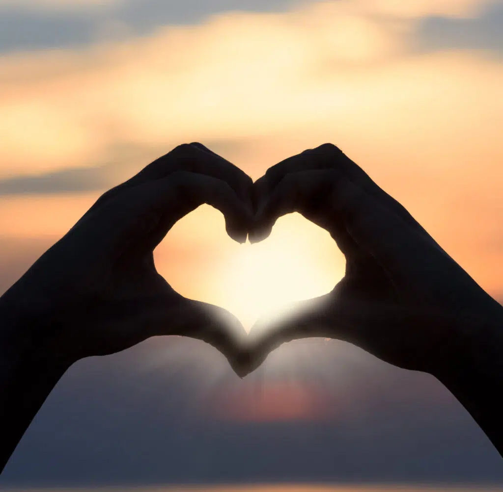 Image of two hands in shape of a heart