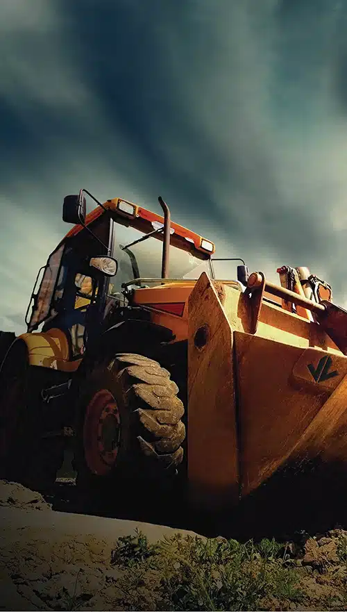 Image of a off highway backhoe loader with Jon Lee Logo on it