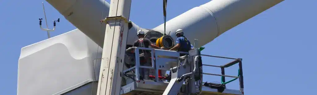 Image of men looking at wind turbine