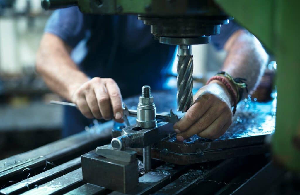 Image of maintenance worker working with metal