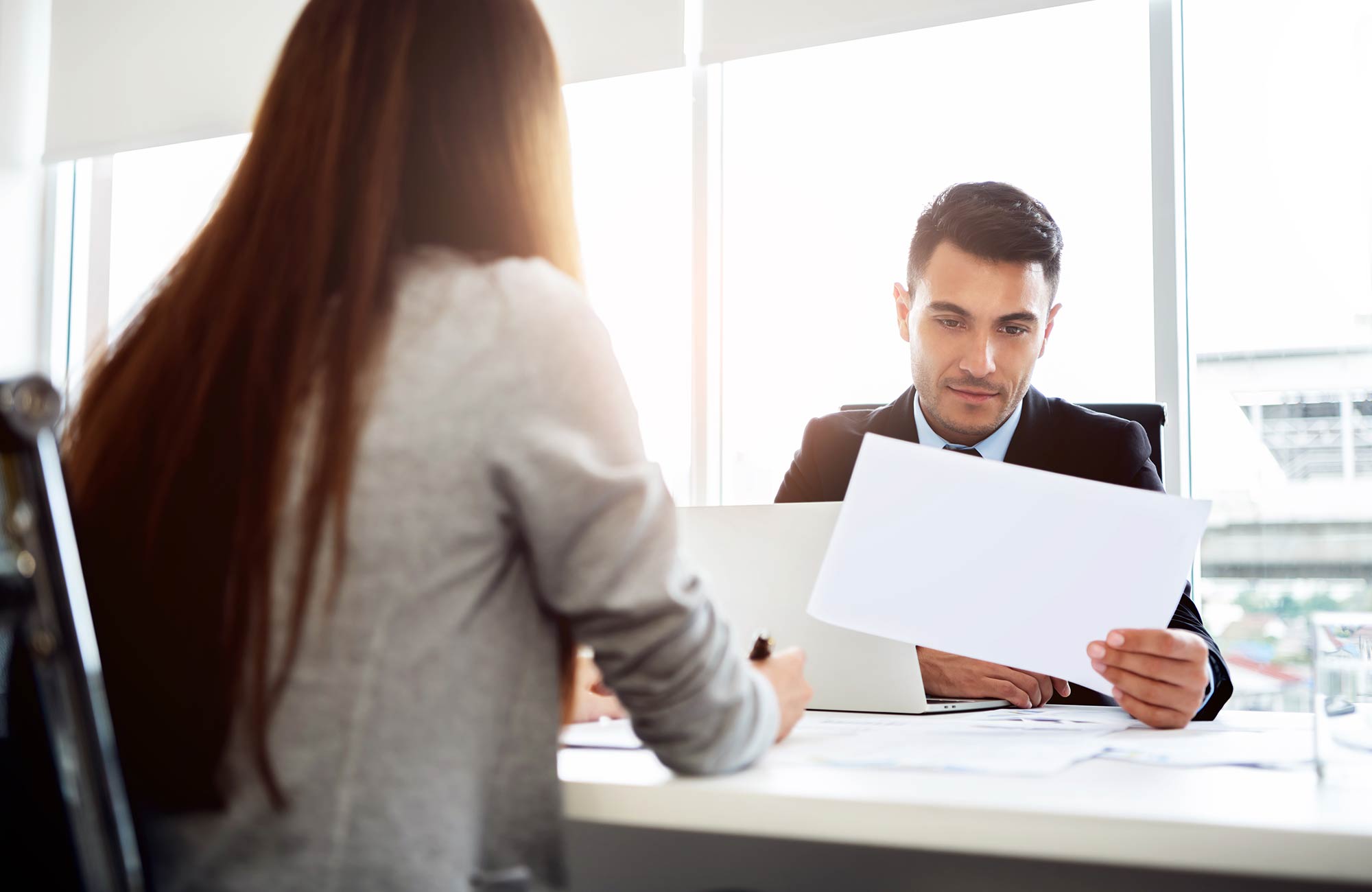 Man and woman looking at cv