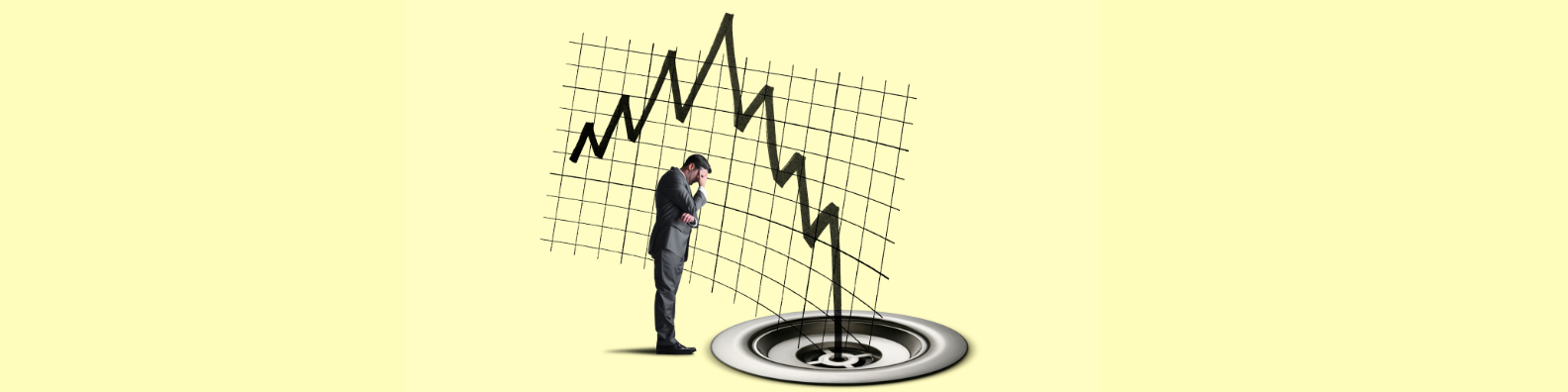 Businessman standing next to plughole with downwards graph next to him