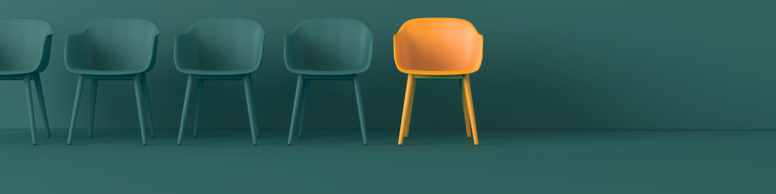 Orange chair standing out amongst three green chairs