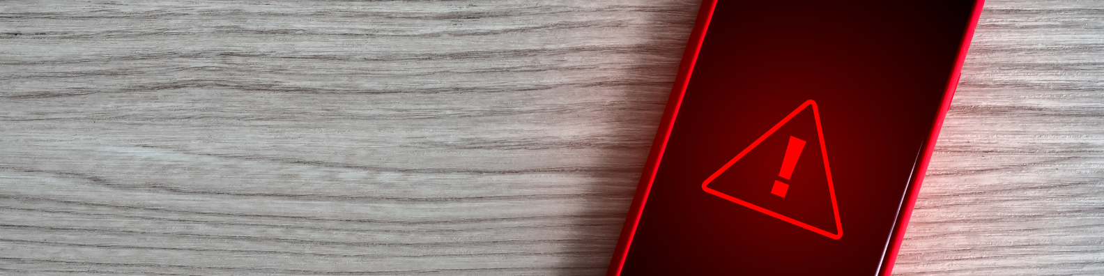 red warning sign on phone