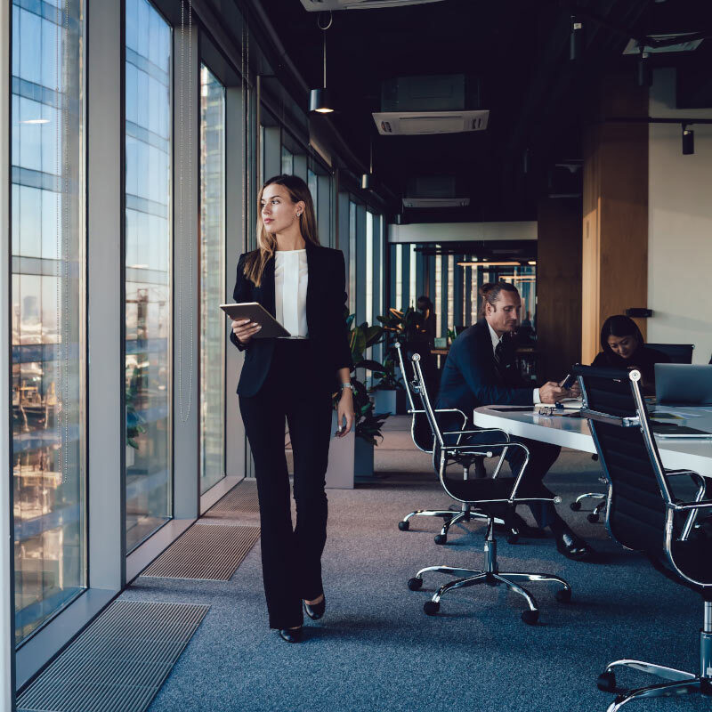 Executive woman looking out of window