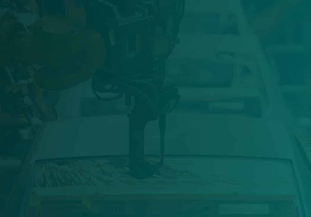 Green background with a factory car line