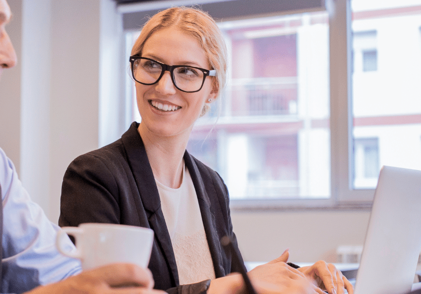 group of mixed professionals working and smiling
